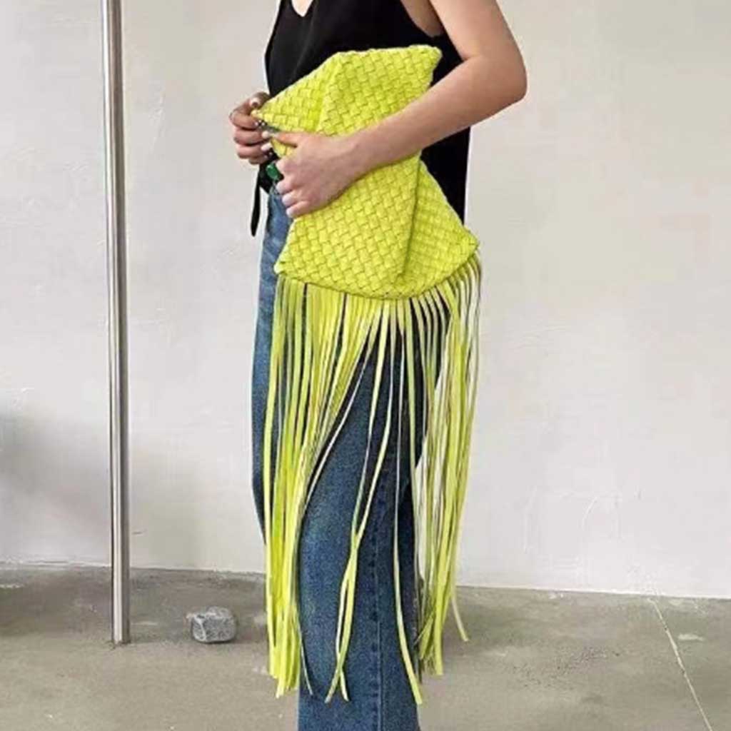 The Alaia Tassel Weave Clutch Bag in chartreuse